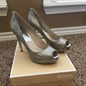 Michael Kors silver glitter heels.